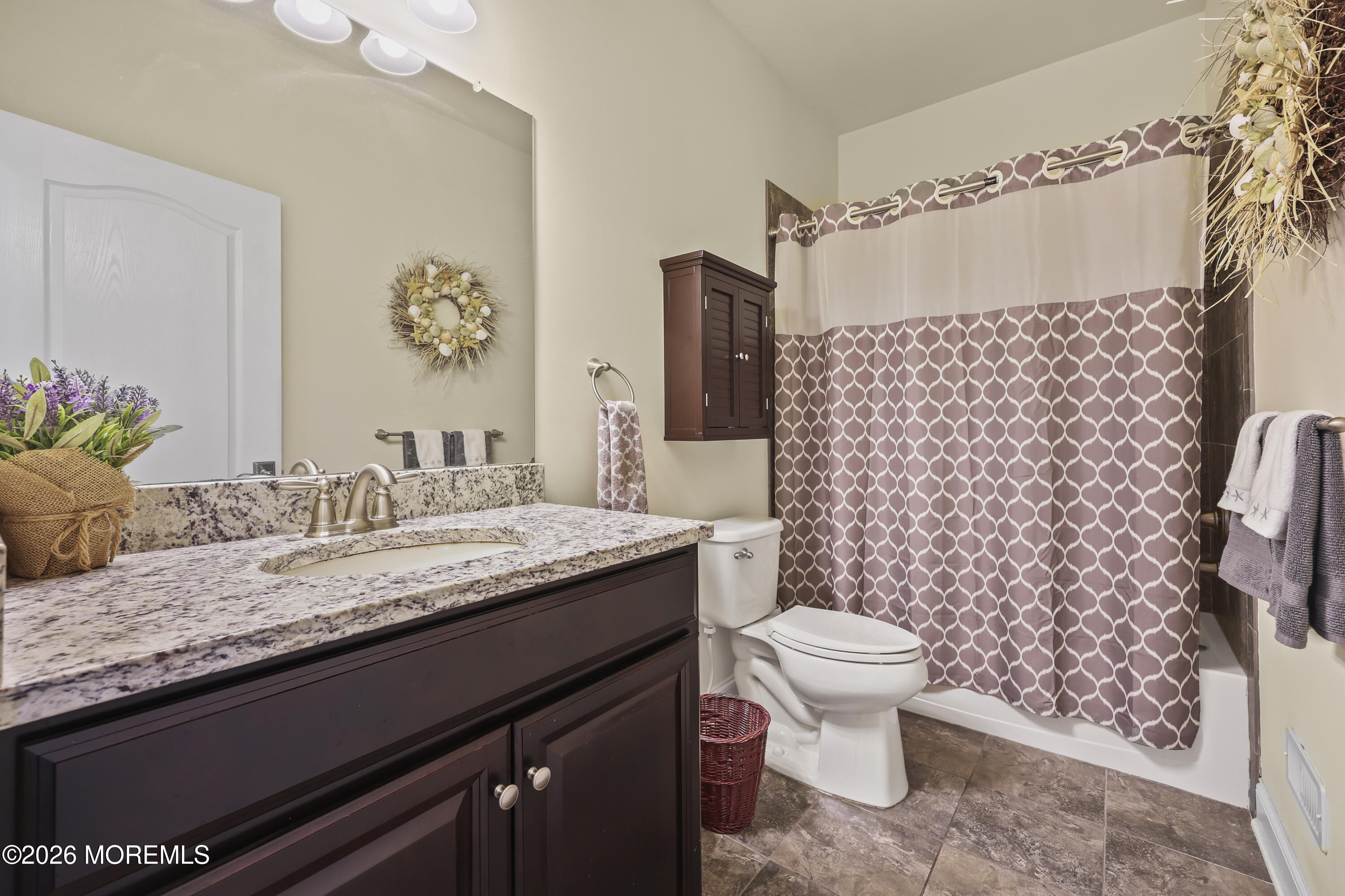 51 Mason Drive Jackson, NJ 08527 - Photo 6 of 39 a bathroom with a granite countertop toilet sink and mirror