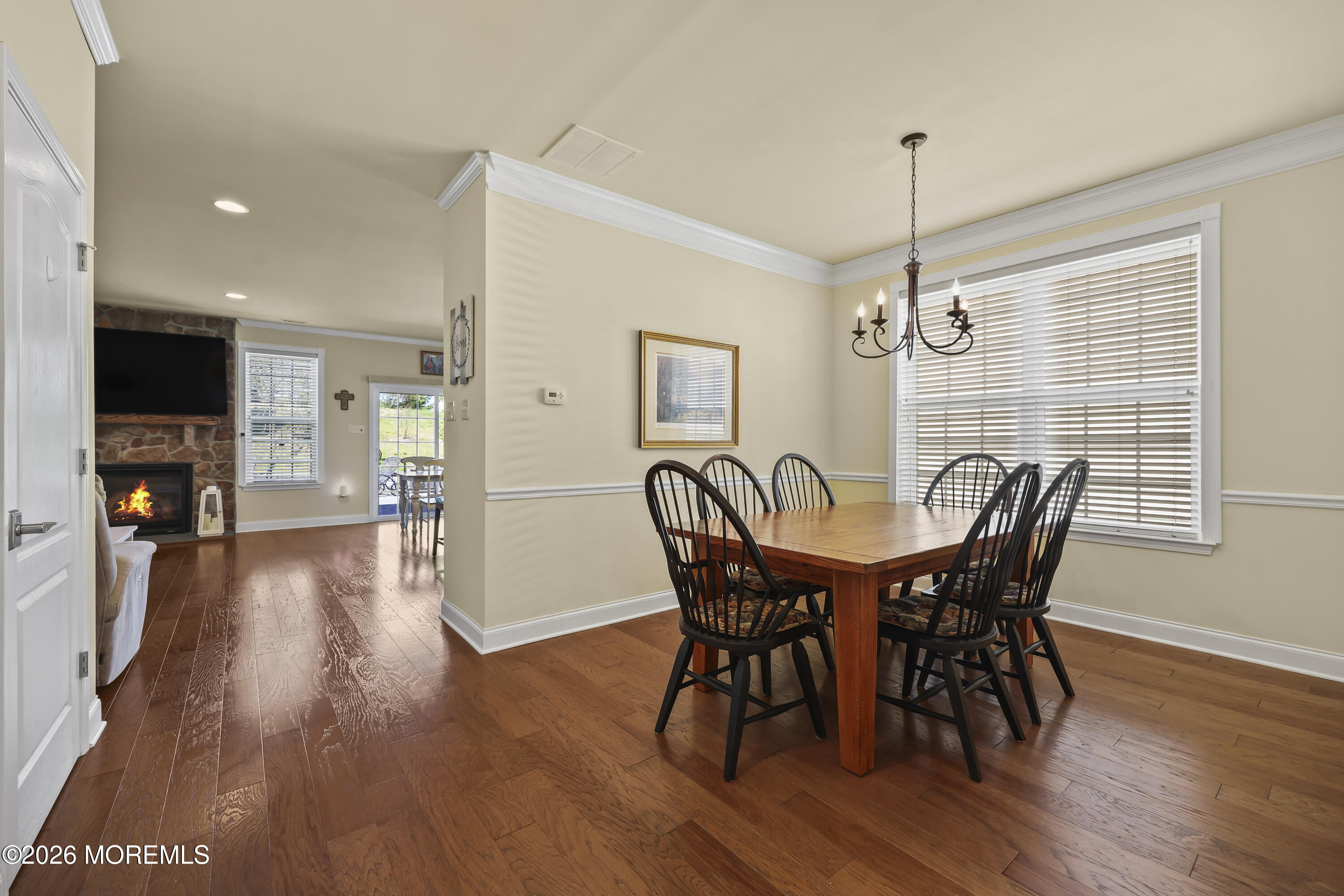 51 Mason Drive Jackson, NJ 08527 - Photo 7 of 39 a view of a dining room with furniture window and wooden floor