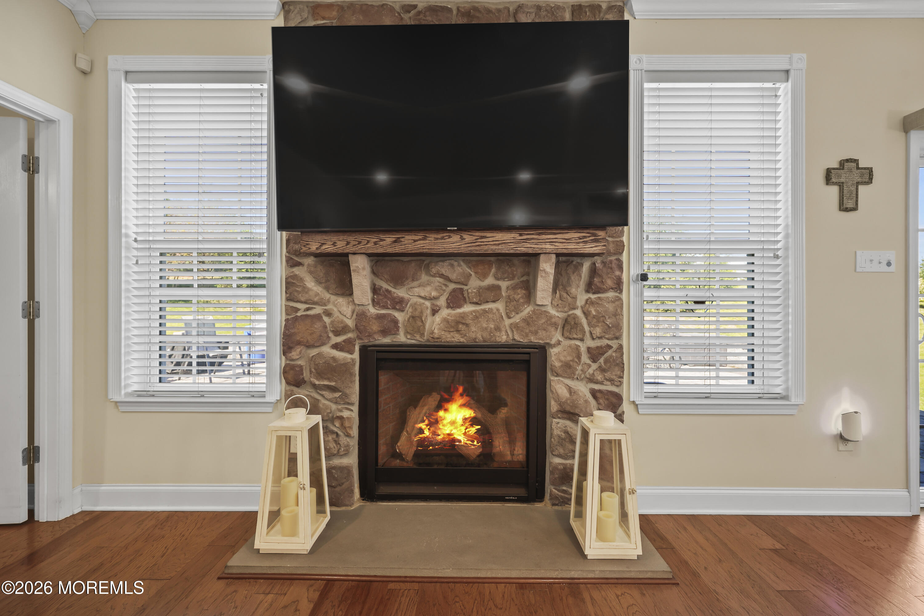 51 Mason Drive Jackson, NJ 08527 - Photo 10 of 39 a living room with a fireplace and a wooden floor
