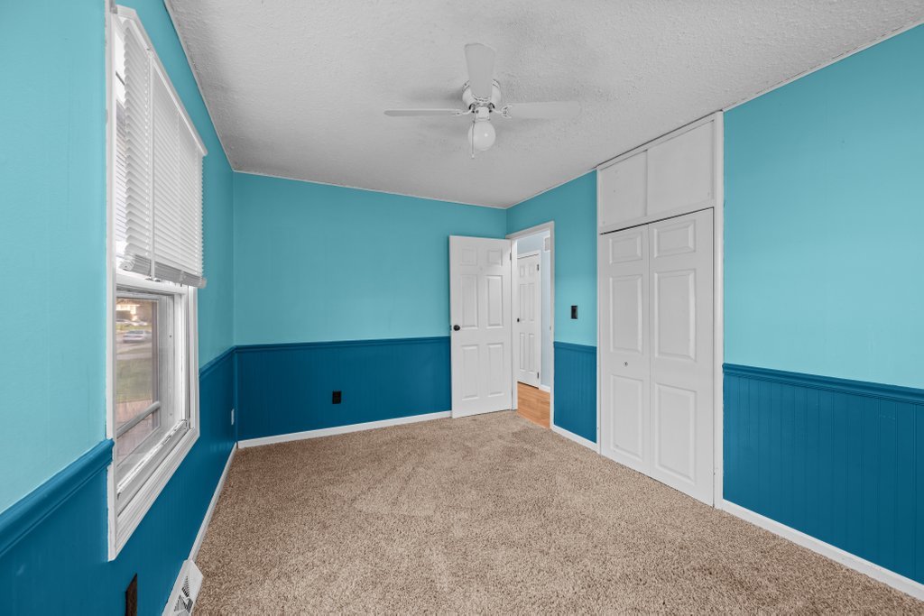 1500 9th Street Northwest Clinton, IA 52732 - Photo 11 of 28 a view of a room with window and a ceiling fan