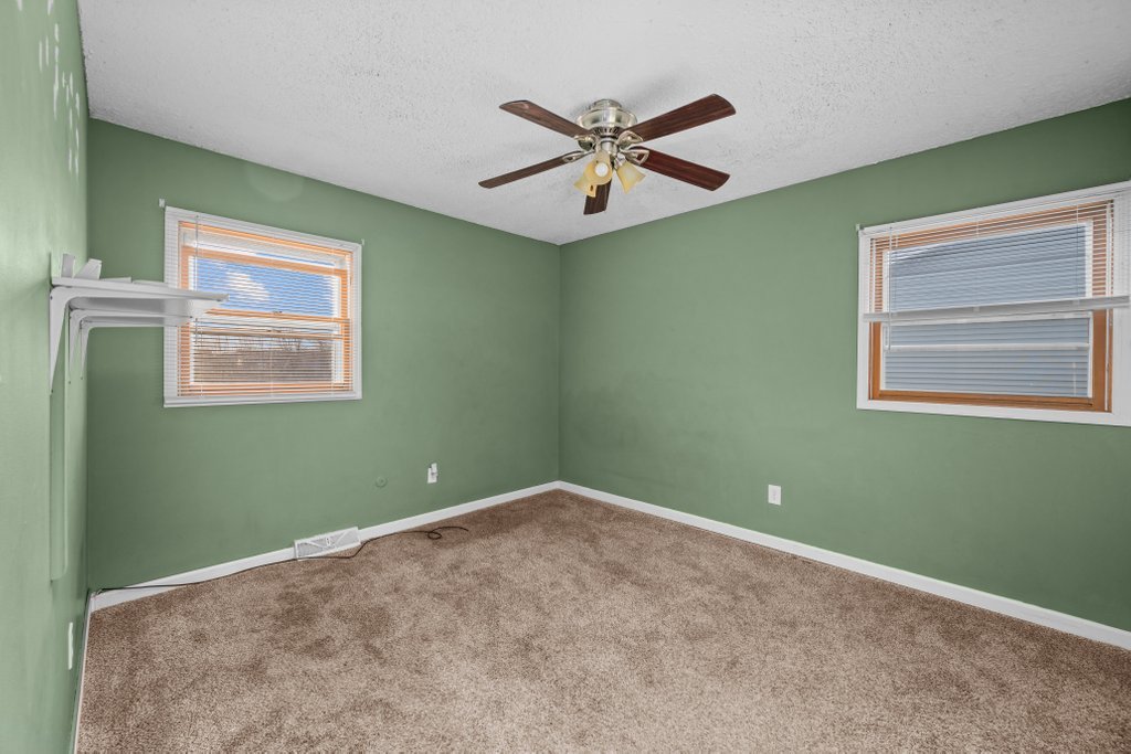 1500 9th Street Northwest Clinton, IA 52732 - Photo 13 of 28 a view of a big room with window and ceiling fan