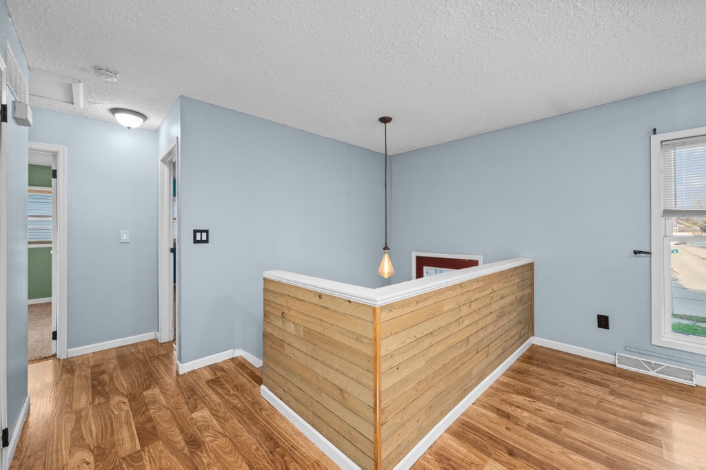 1500 9th Street Northwest Clinton, IA 52732 - Photo 8 of 28 a view of a bedroom with wooden floor