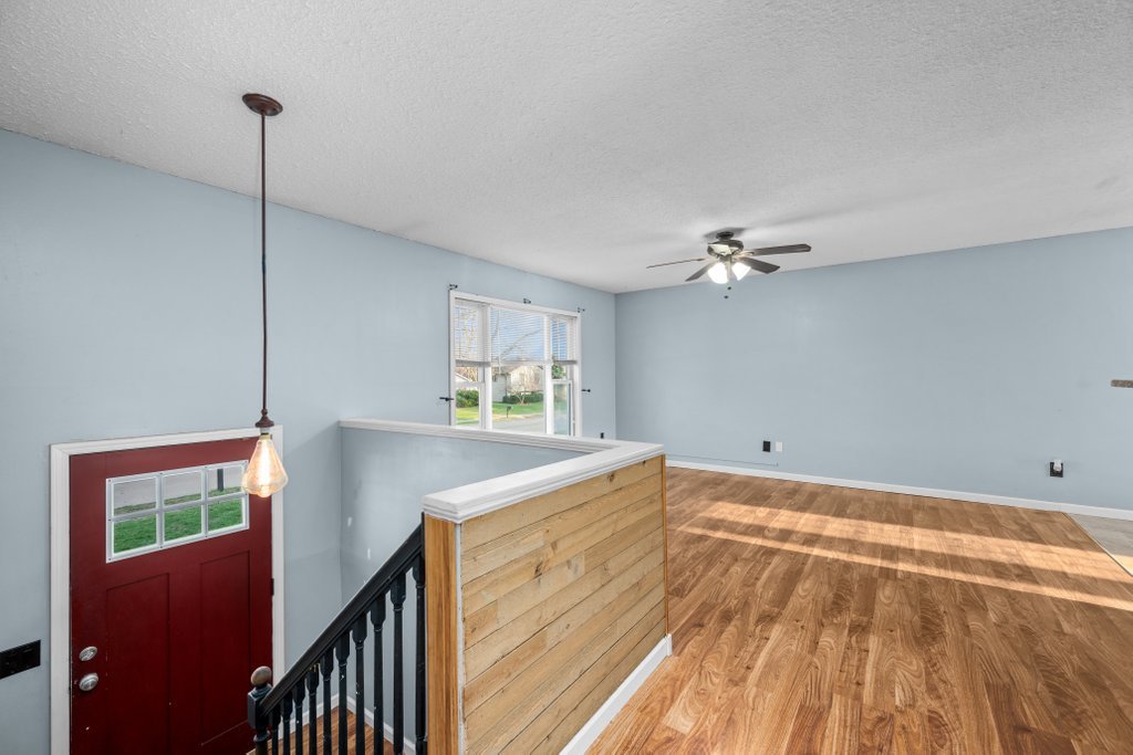 1500 9th Street Northwest Clinton, IA 52732 - Photo 9 of 28 a view of a room with wooden floor and staircase