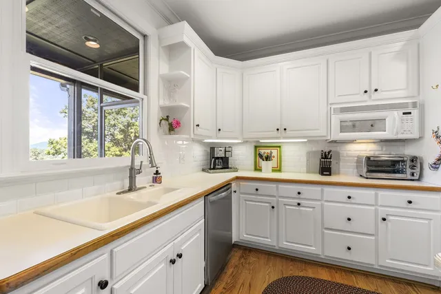 a view of a two chairs in the balcony