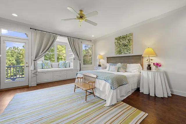 a spacious bathroom with a tub sink and mirror