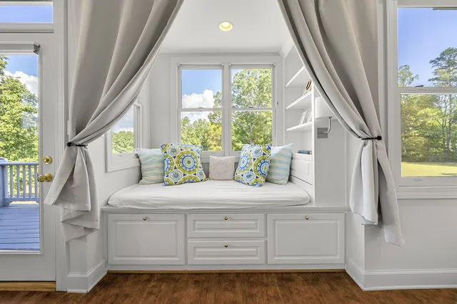 a bed room with a bed and a chair