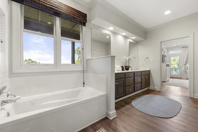 a bathroom with a sink a light fixture and a mirror