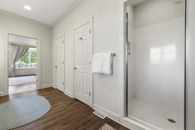 a white toilet sitting next to a bath tub