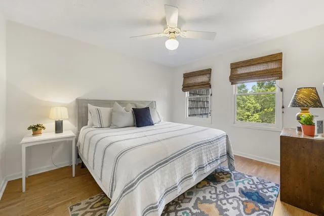 a balcony with wooden floor and fence