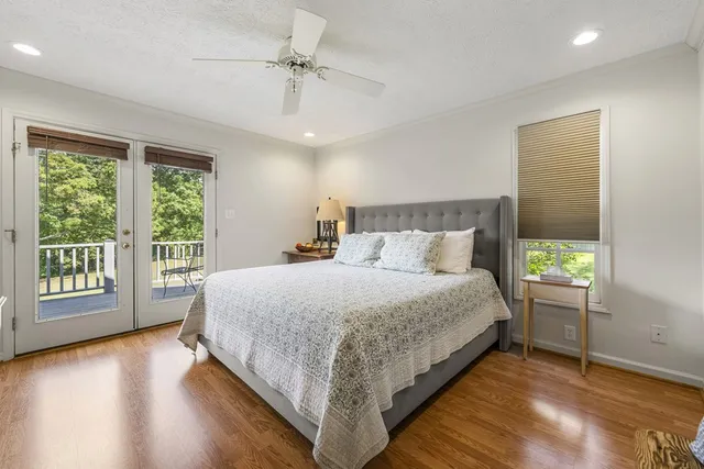 a room with pool table and windows