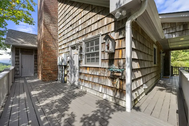 a view of a livingroom with furniture and a window