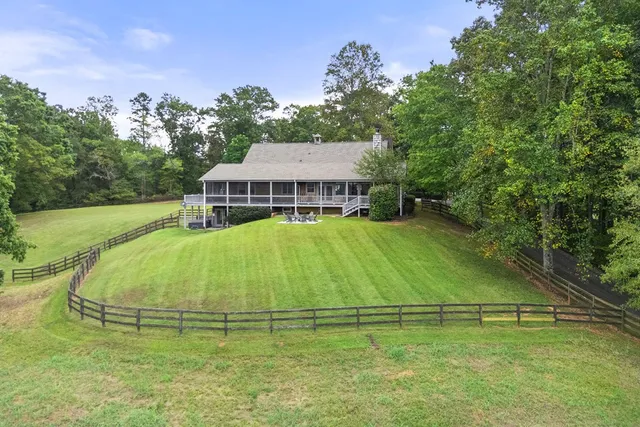 a aerial view of a house with a yard