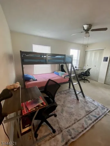 a bed room with a bed and a chair