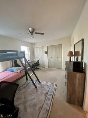 a bedroom with furniture and a chandelier