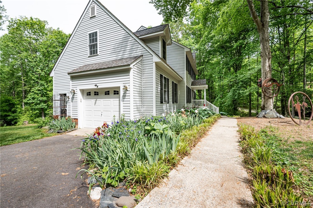4501 Lakeview Road Gum Spring, VA 23065 - Photo 2 of 45 a house with a yard and potted plants
