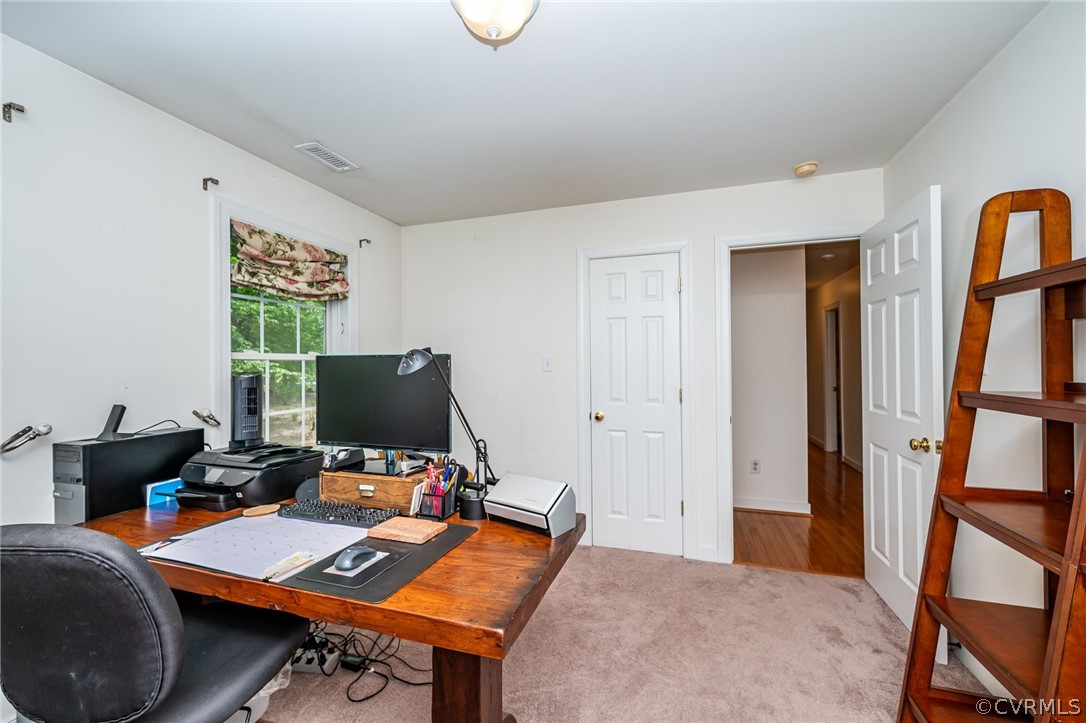 4501 Lakeview Road Gum Spring, VA 23065 - Photo 21 of 45 a view of a workspace with furniture and a window