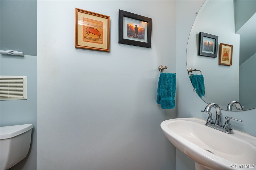 4501 Lakeview Road Gum Spring, VA 23065 - Photo 33 of 45 a bathroom with a toilet and a sink