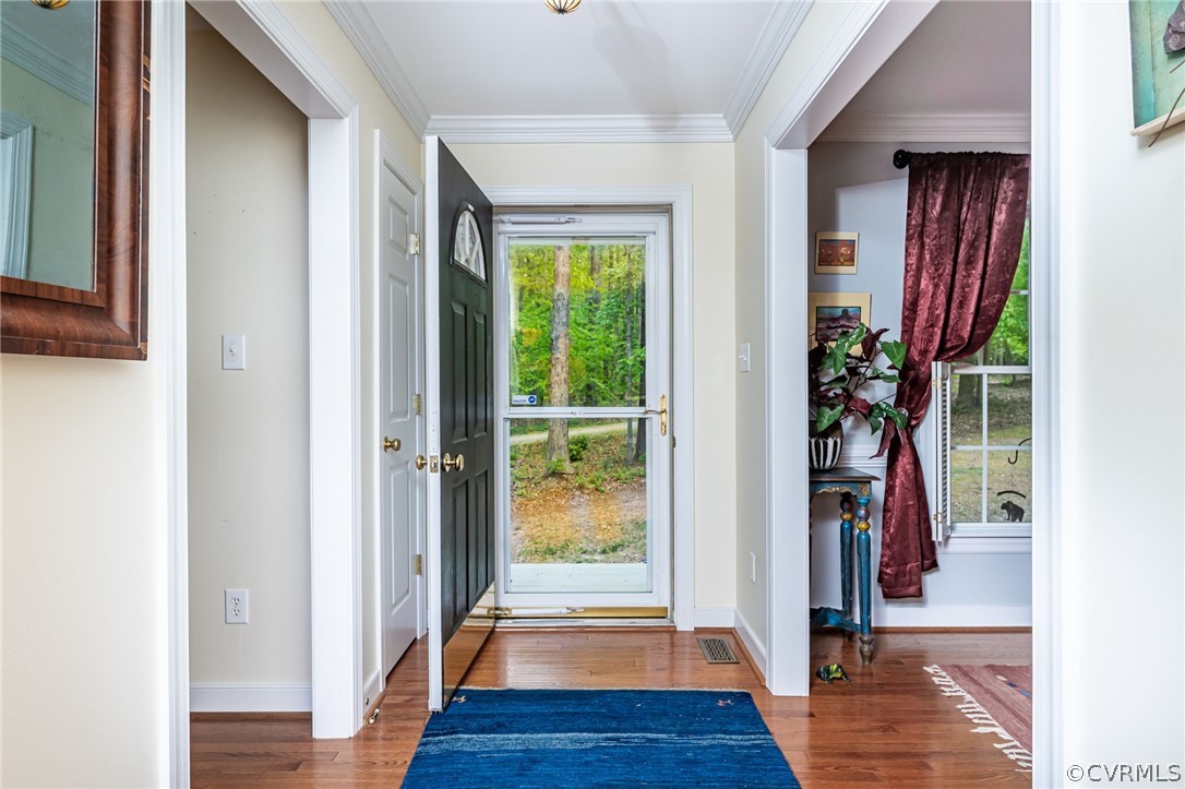 4501 Lakeview Road Gum Spring, VA 23065 - Photo 5 of 45 a view of a hallway with wooden floor and windows