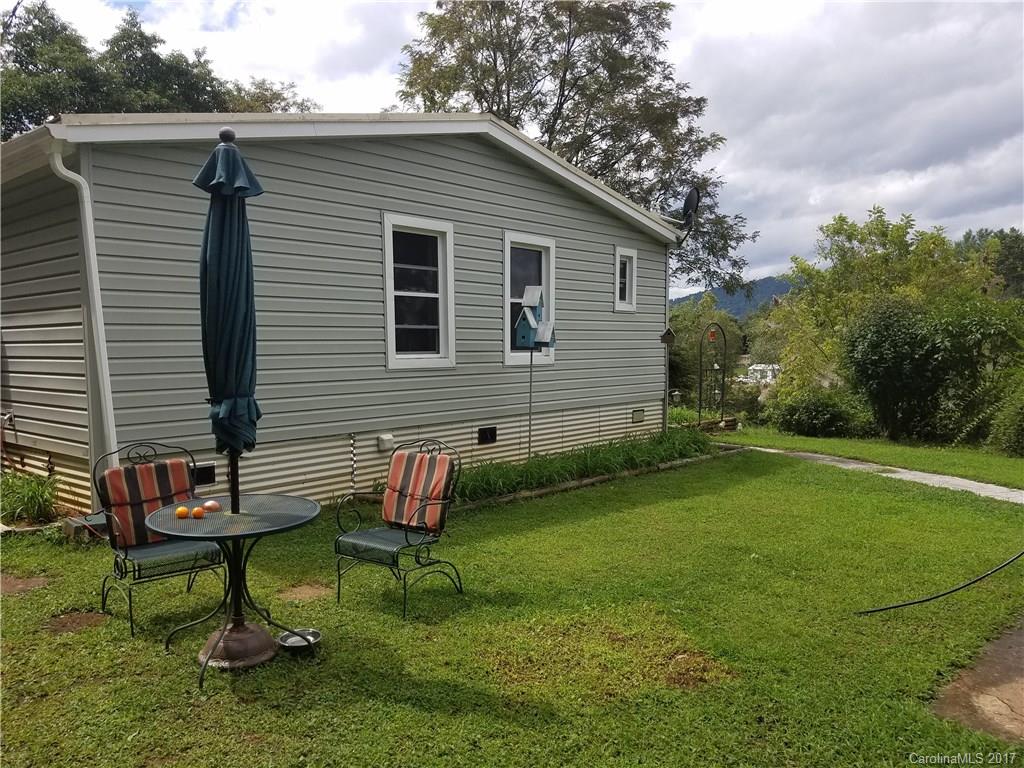 433 Abel Road Canton, NC 28716 - Photo 2 of 18 a backyard of a house with seating space