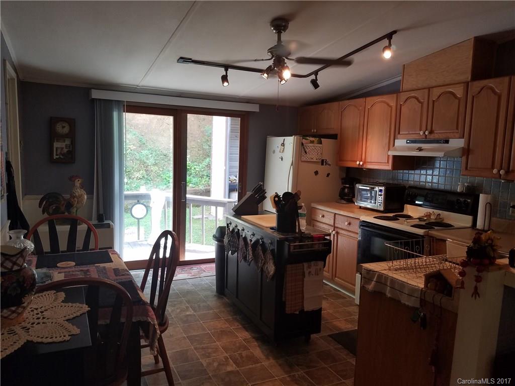 433 Abel Road Canton, NC 28716 - Photo 12 of 18 a view of a dining room with furniture window and outside view