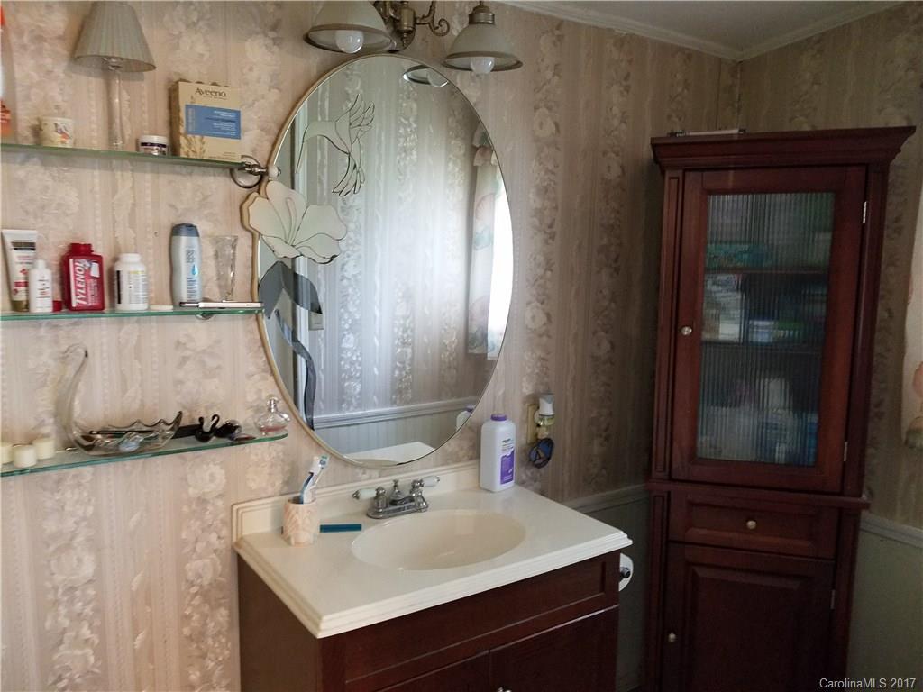 433 Abel Road Canton, NC 28716 - Photo 15 of 18 a bathroom with a sink vanity and mirror