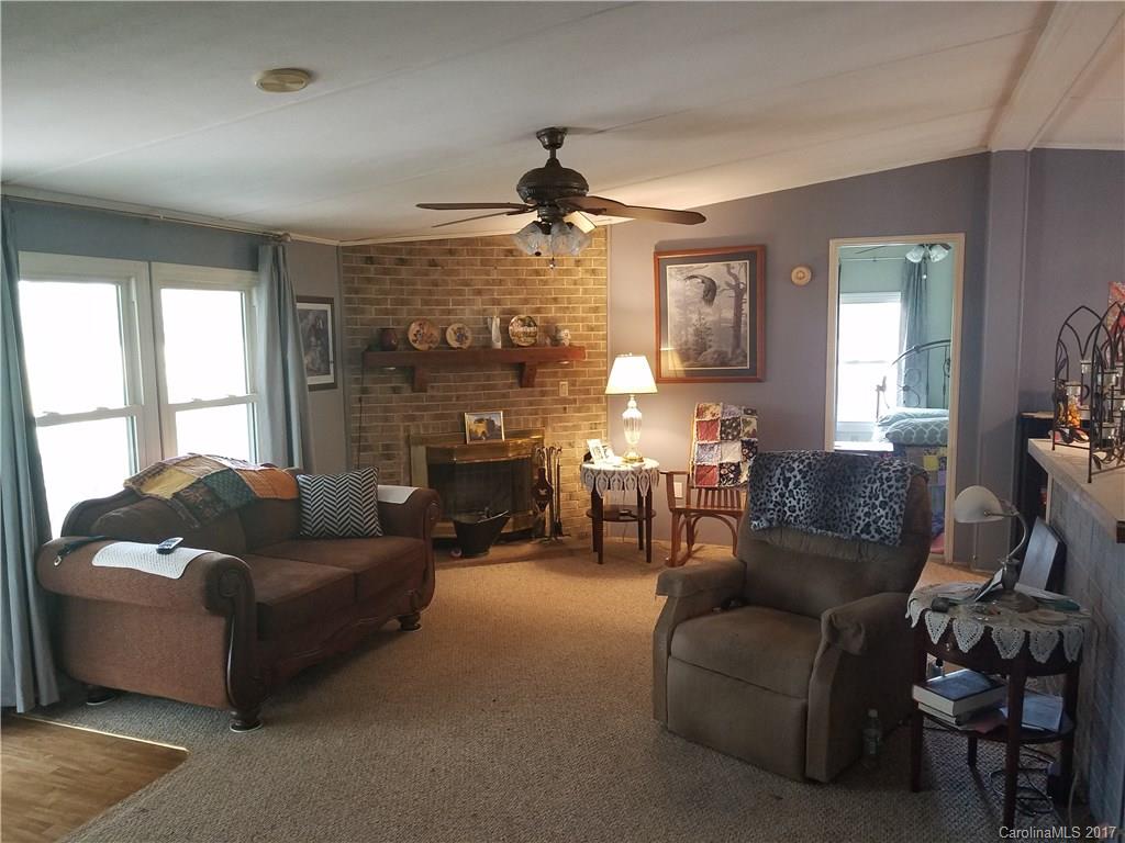 433 Abel Road Canton, NC 28716 - Photo 10 of 18 a living room with furniture and a fireplace