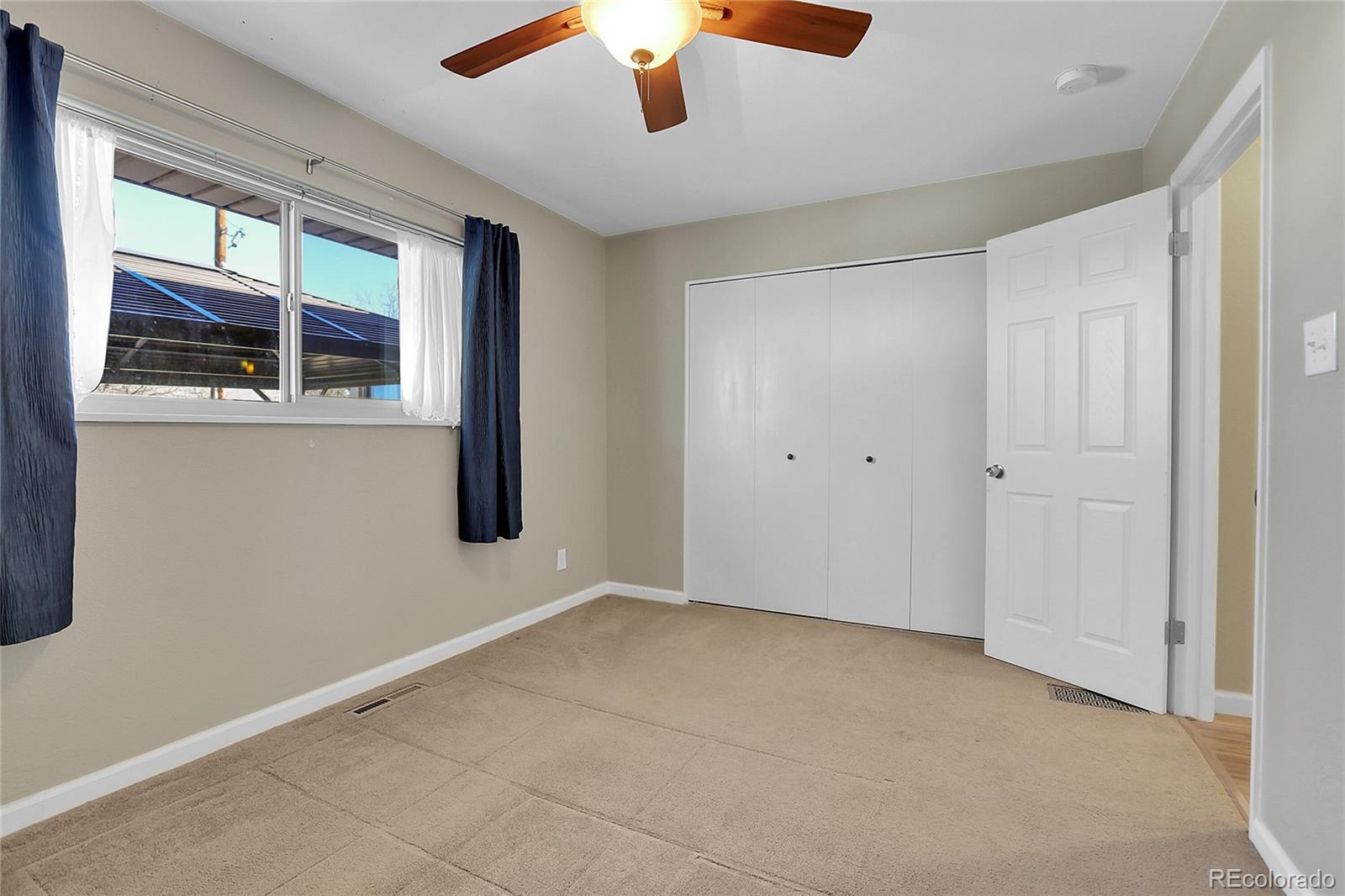 7539 East Easter Place Centennial, CO 80112 - Photo 23 of 40 an empty room with windows