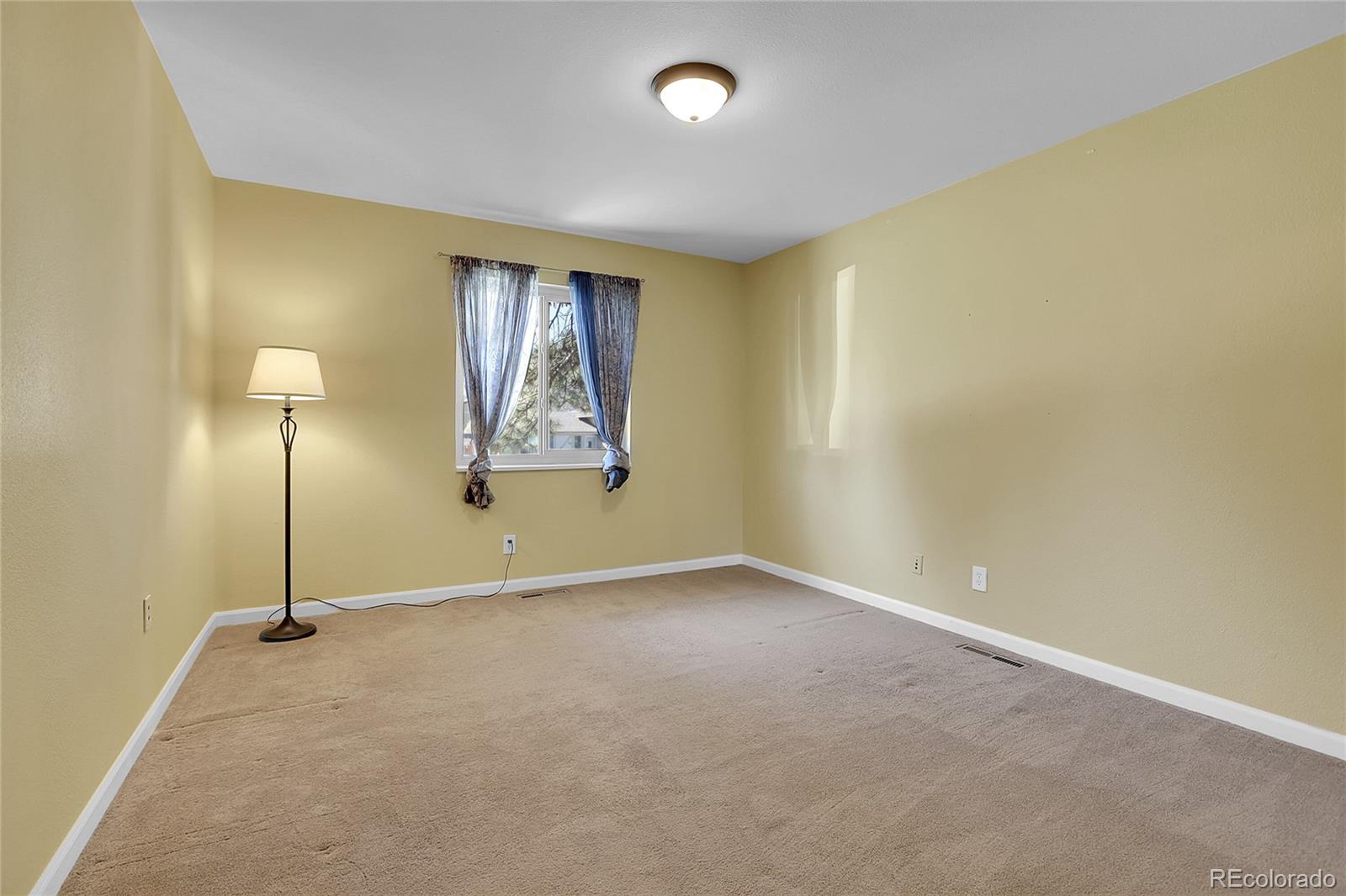 7539 East Easter Place Centennial, CO 80112 - Photo 26 of 40 a view of an empty room with a window
