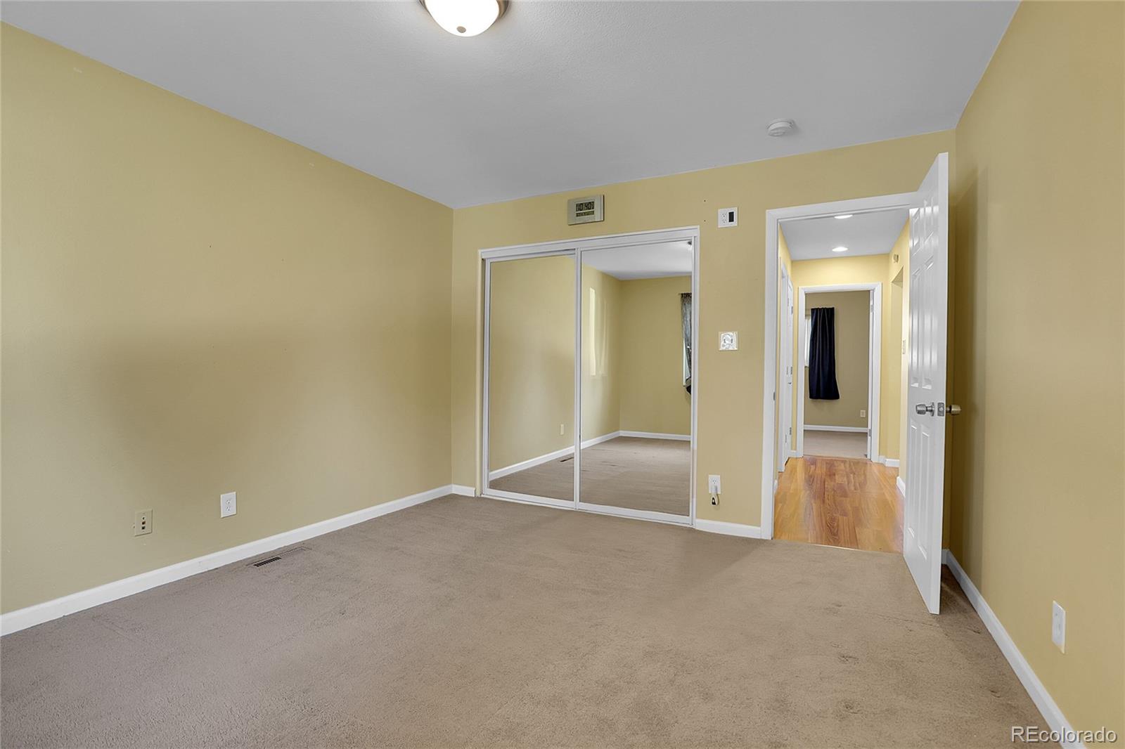 7539 East Easter Place Centennial, CO 80112 - Photo 27 of 40 an empty room with a bathroom and mirror