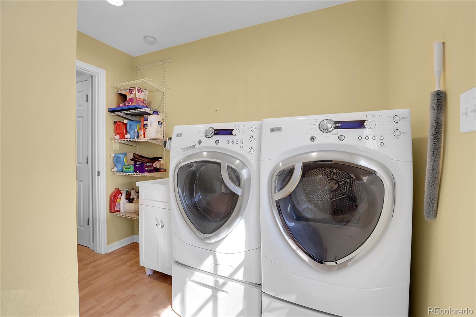 7539 East Easter Place Centennial, CO 80112 - Photo 29 of 40 a utility room with dryer and washer