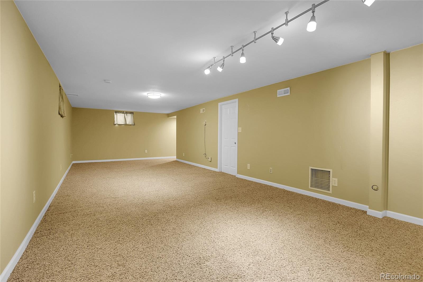 7539 East Easter Place Centennial, CO 80112 - Photo 31 of 40 an empty room with a empty space and windows