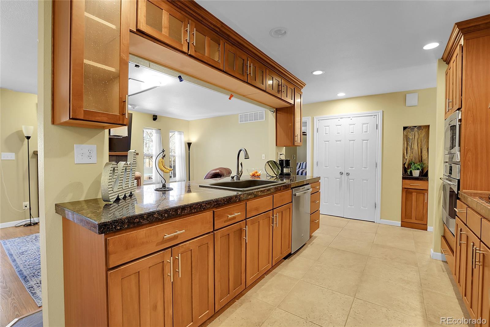 7539 East Easter Place Centennial, CO 80112 - Photo 10 of 40 a spacious bathroom with a granite countertop sink and a mirror