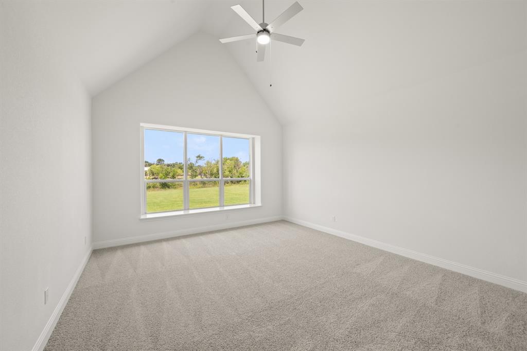 27 Old Crow Road Joshua, TX 76058 - Photo 22 of 35 an empty room with a window and a ceiling fan