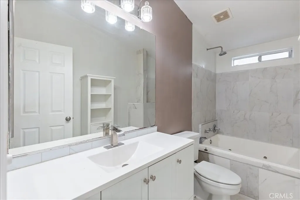 9080 Bloomfield Avenue, Unit 237 Cypress, CA 90630 - Photo 16 of 24 a bathroom with a sink a toilet and shower