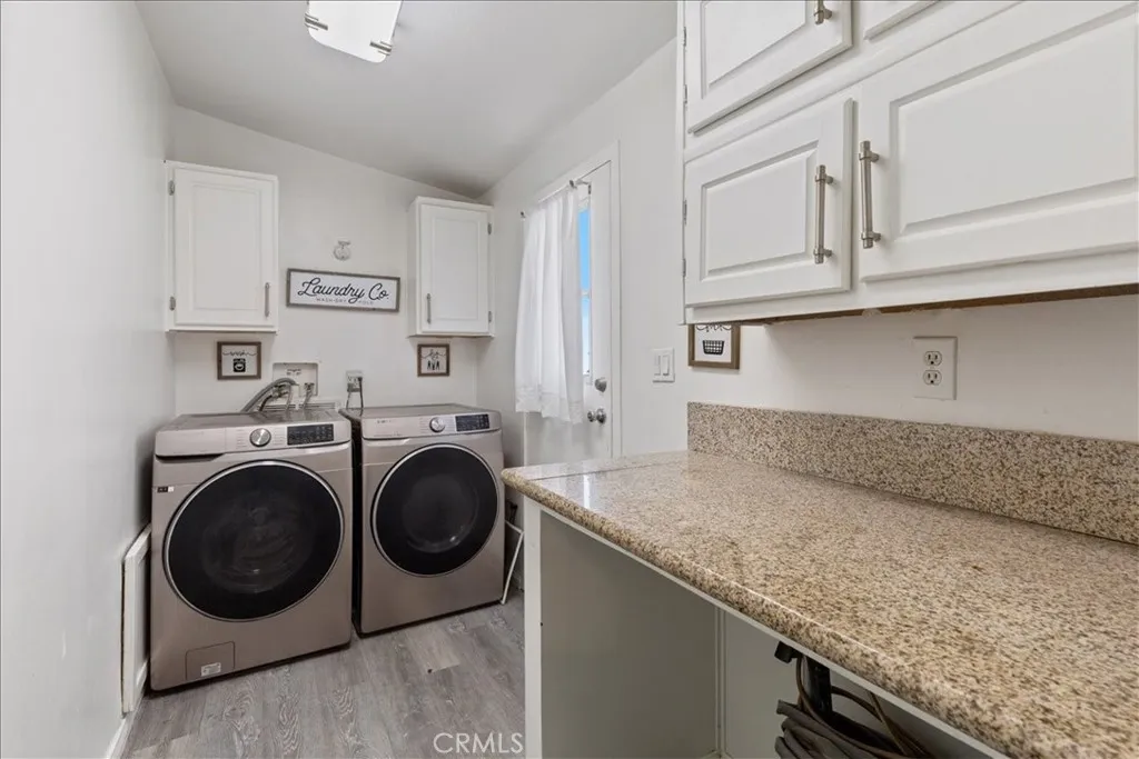 9080 Bloomfield Avenue, Unit 237 Cypress, CA 90630 - Photo 21 of 24 a utility room with sink dryer and washer