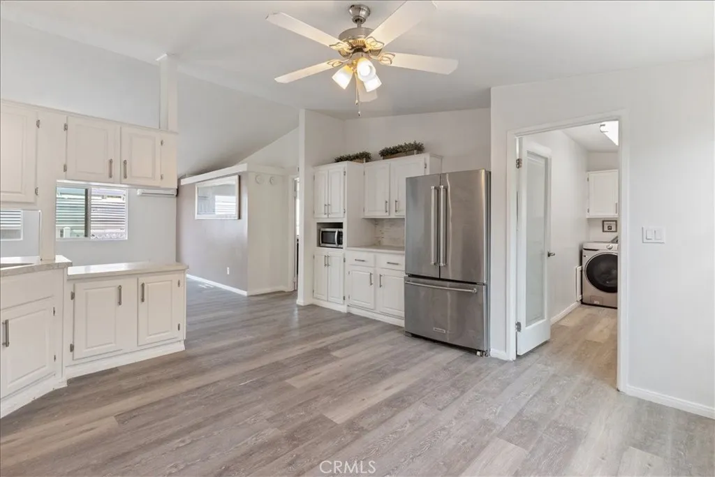 9080 Bloomfield Avenue, Unit 237 Cypress, CA 90630 - Photo 6 of 24 a kitchen with a refrigerator a sink and dishwasher
