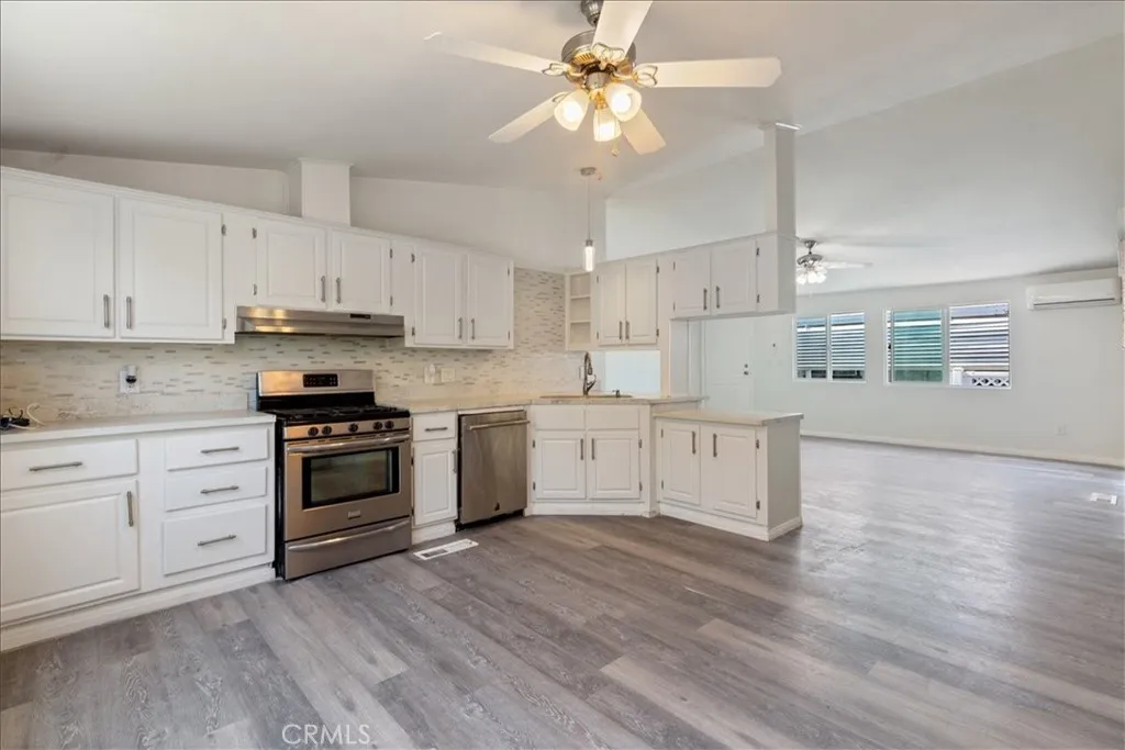 9080 Bloomfield Avenue, Unit 237 Cypress, CA 90630 - Photo 7 of 24 a kitchen with stainless steel appliances white cabinets and a sink
