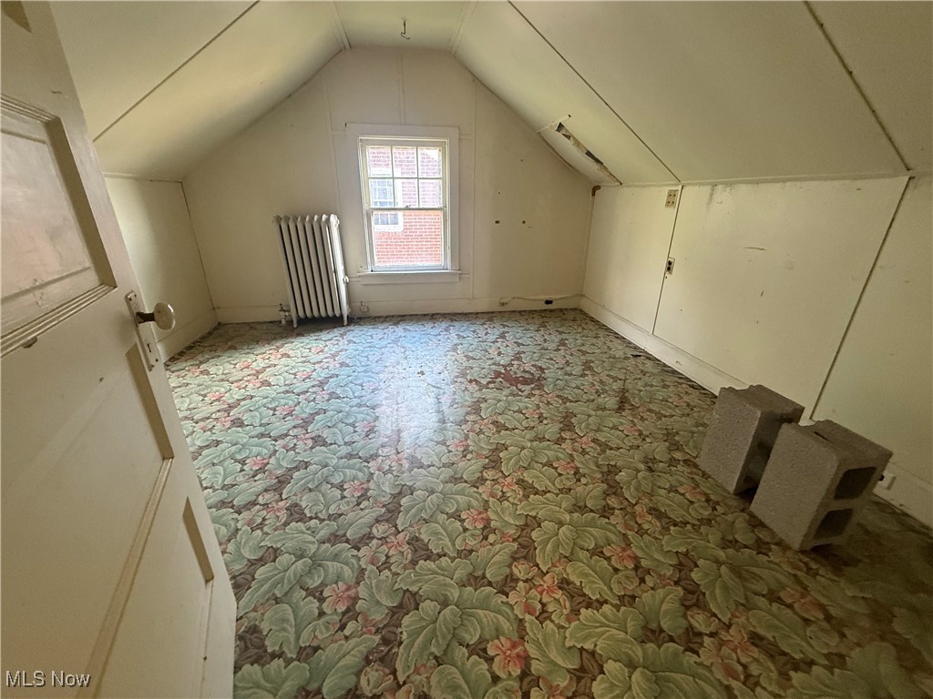 1979 Staunton Road Cleveland, OH 44118 - Photo 26 of 37 Additional living space with lofted ceiling and radiator heating unit