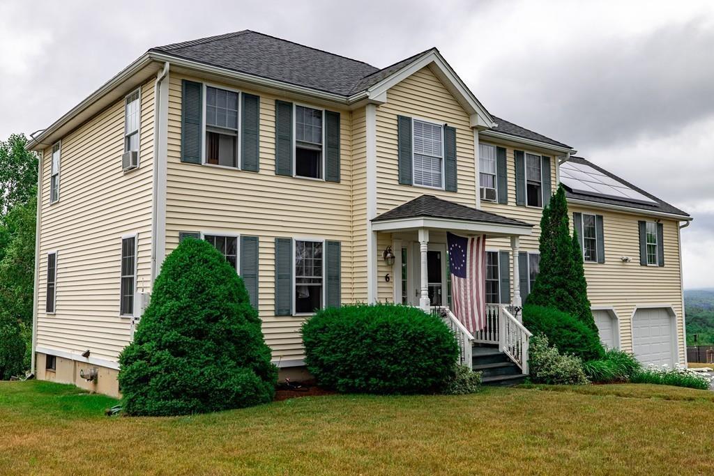 6 Carley Circle Rutland, MA 01543 - Photo 1 of 39 a front view of a house with a yard and garage