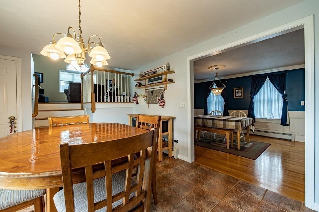 6 Carley Circle Rutland, MA 01543 - Photo 16 of 39 a view of a dining room with furniture and a chandelier