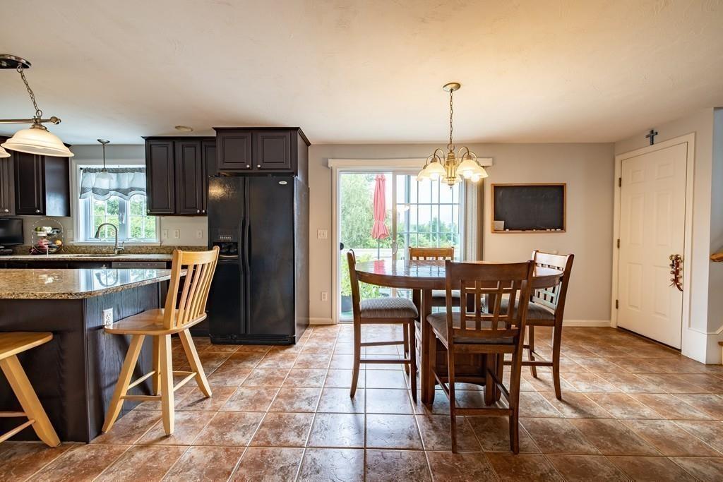 6 Carley Circle Rutland, MA 01543 - Photo 17 of 39 a dining room with furniture window and wooden floor