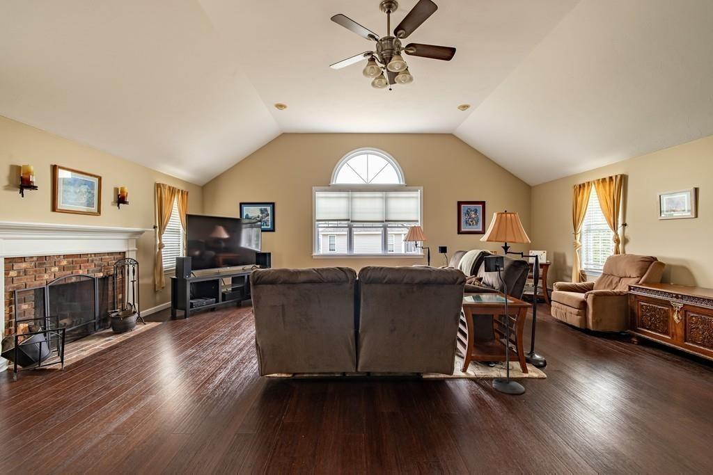 6 Carley Circle Rutland, MA 01543 - Photo 19 of 39 a living room with furniture a fireplace and a large window