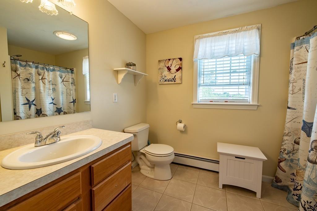6 Carley Circle Rutland, MA 01543 - Photo 28 of 39 a bathroom with a sink toilet and shower