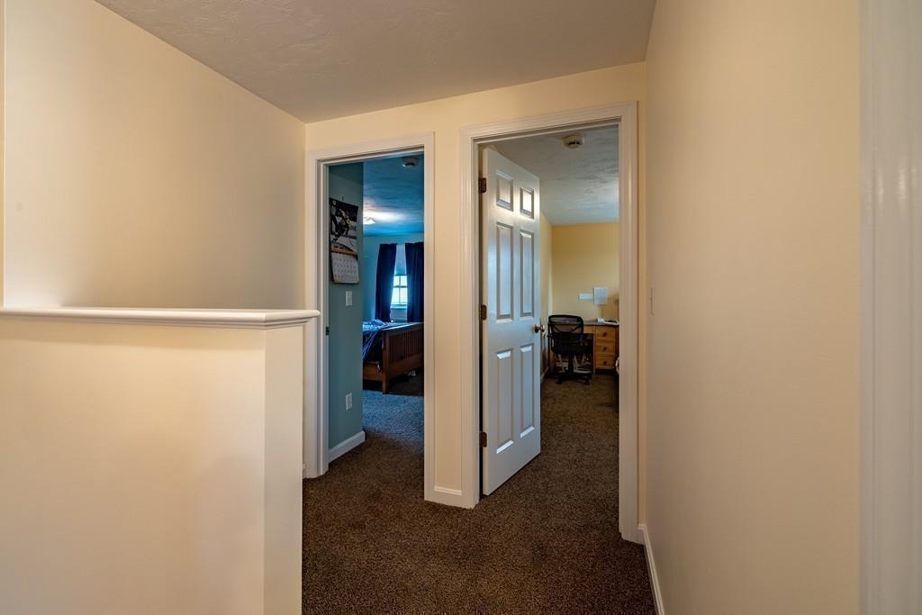 6 Carley Circle Rutland, MA 01543 - Photo 29 of 39 a view of a hallway with closet and a livingroom view