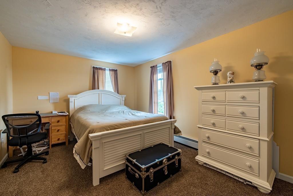 6 Carley Circle Rutland, MA 01543 - Photo 30 of 39 a bedroom with a bed and a dresser