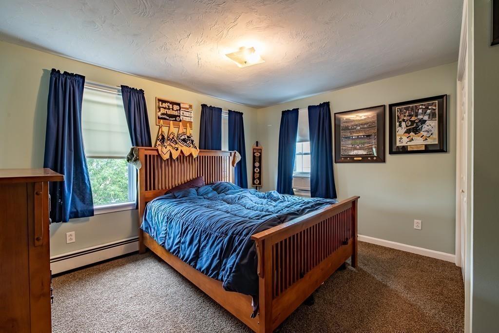 6 Carley Circle Rutland, MA 01543 - Photo 31 of 39 a bedroom with a bed next to a window