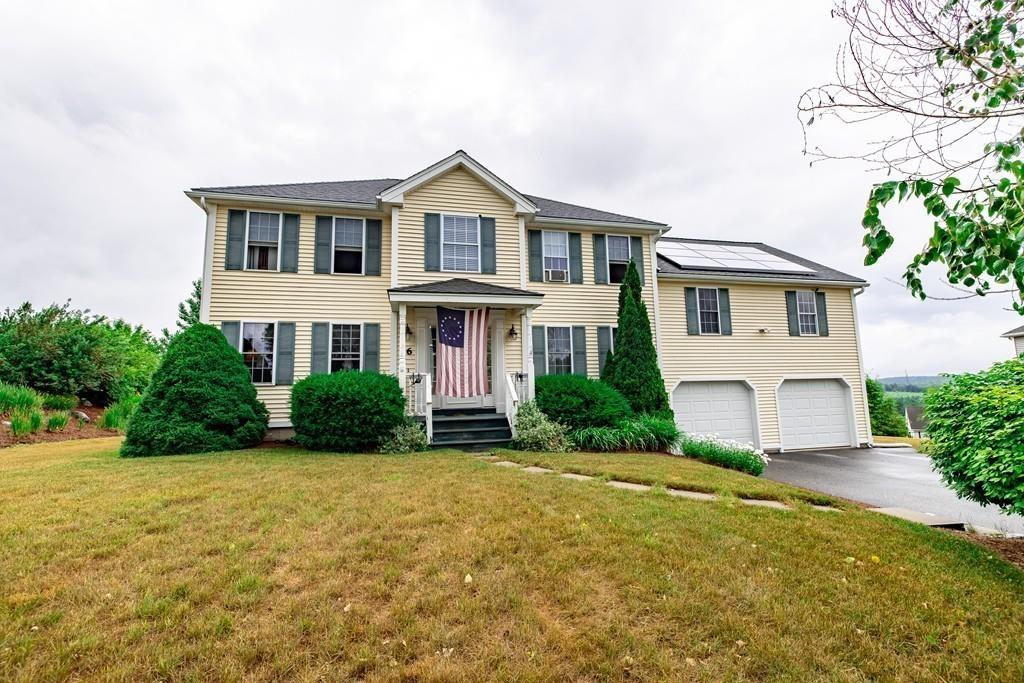 6 Carley Circle Rutland, MA 01543 - Photo 5 of 39 a front view of a house with a yard and garage