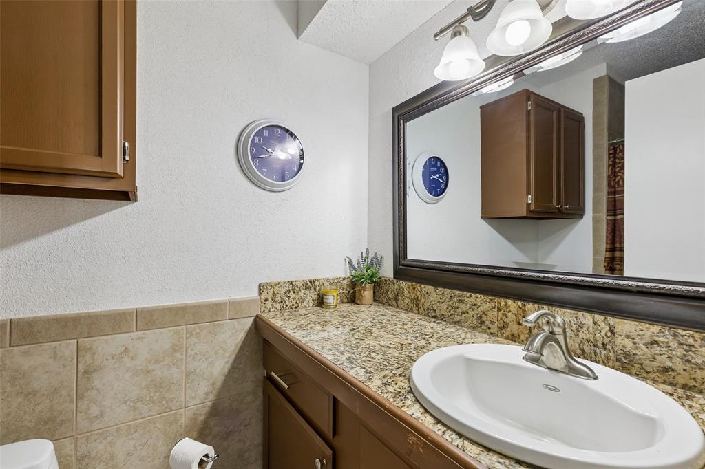 1317 Trinity View Street Irving, TX 75060 - Photo 11 of 31 a bathroom with a sink and a mirror