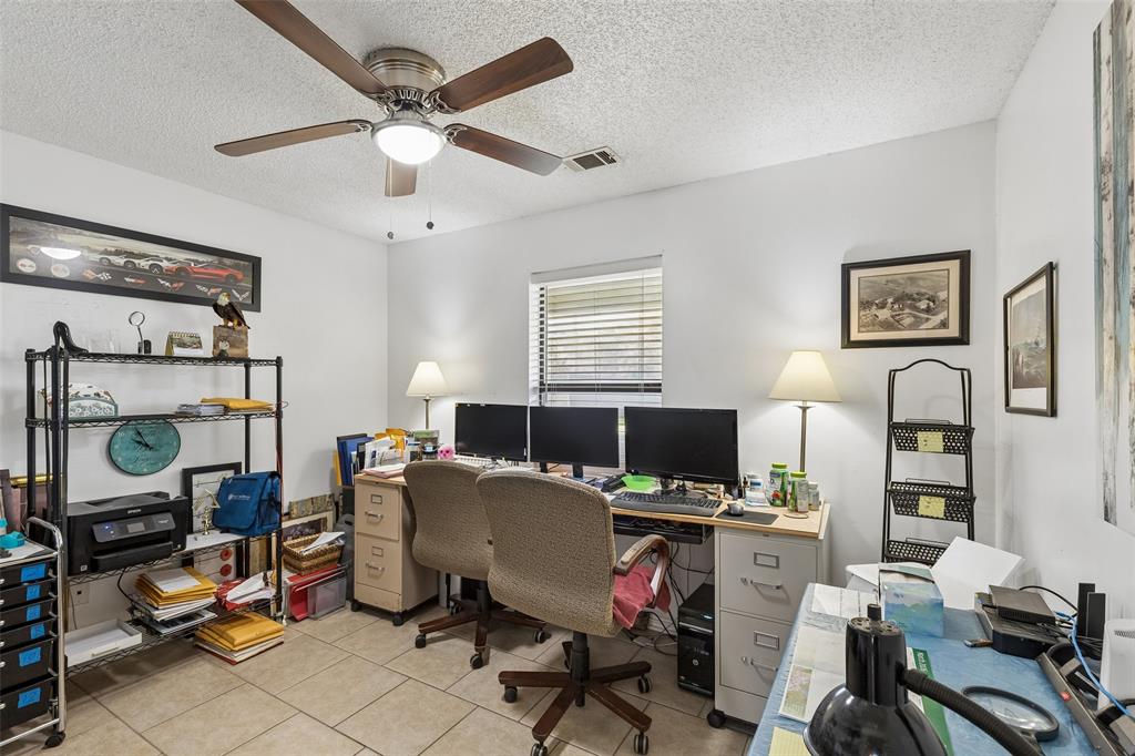 1317 Trinity View Street Irving, TX 75060 - Photo 12 of 31 a view of a workspace with furniture and a window