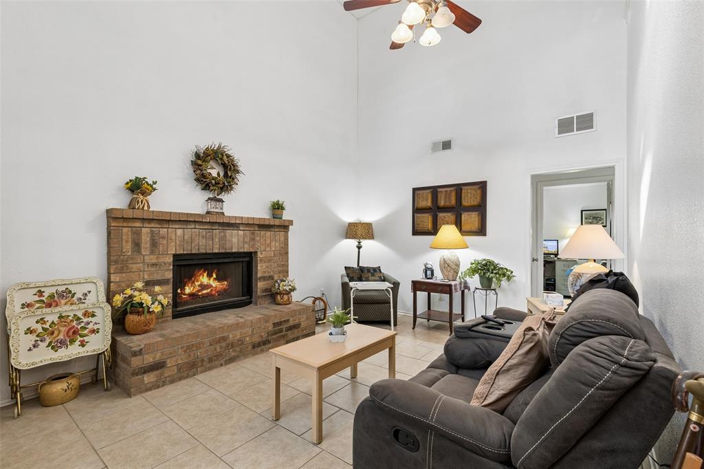 1317 Trinity View Street Irving, TX 75060 - Photo 14 of 31 a living room with furniture and a fireplace